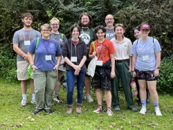 A group of people gather for a group photo