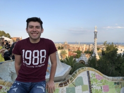 Mason Griffith, a senior biology major from Pikeville, sits smiling on a bench.