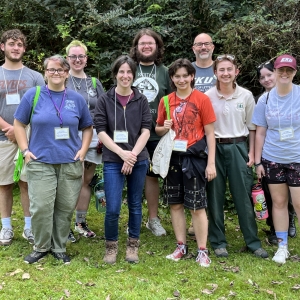 A group of people gather for a group photo